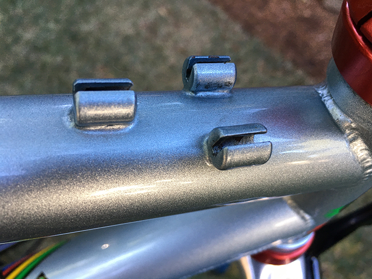 Top tube cable stops