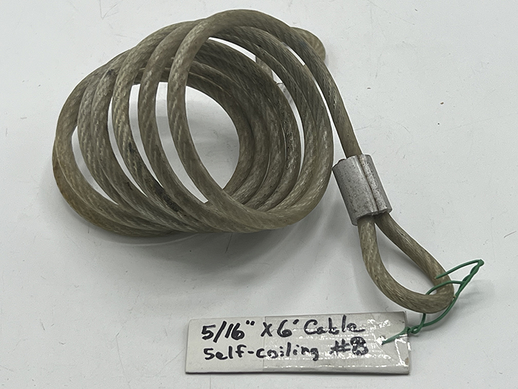 Self coiling bicycle security cable
